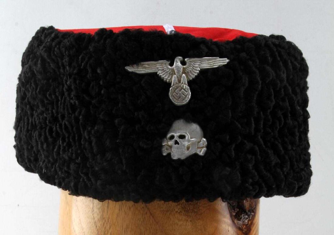 WWII THIRD REICH GERMAN PAPAKHA HAT WITH SS EMBLEM: Third Reich Cossack style "Papakha" hat. Hat has Third Reich eagle emblem as well as the SS "Totenkopf" skull and cross bones emblem on the front. Hat made for cold weather conditions. --Great conditi