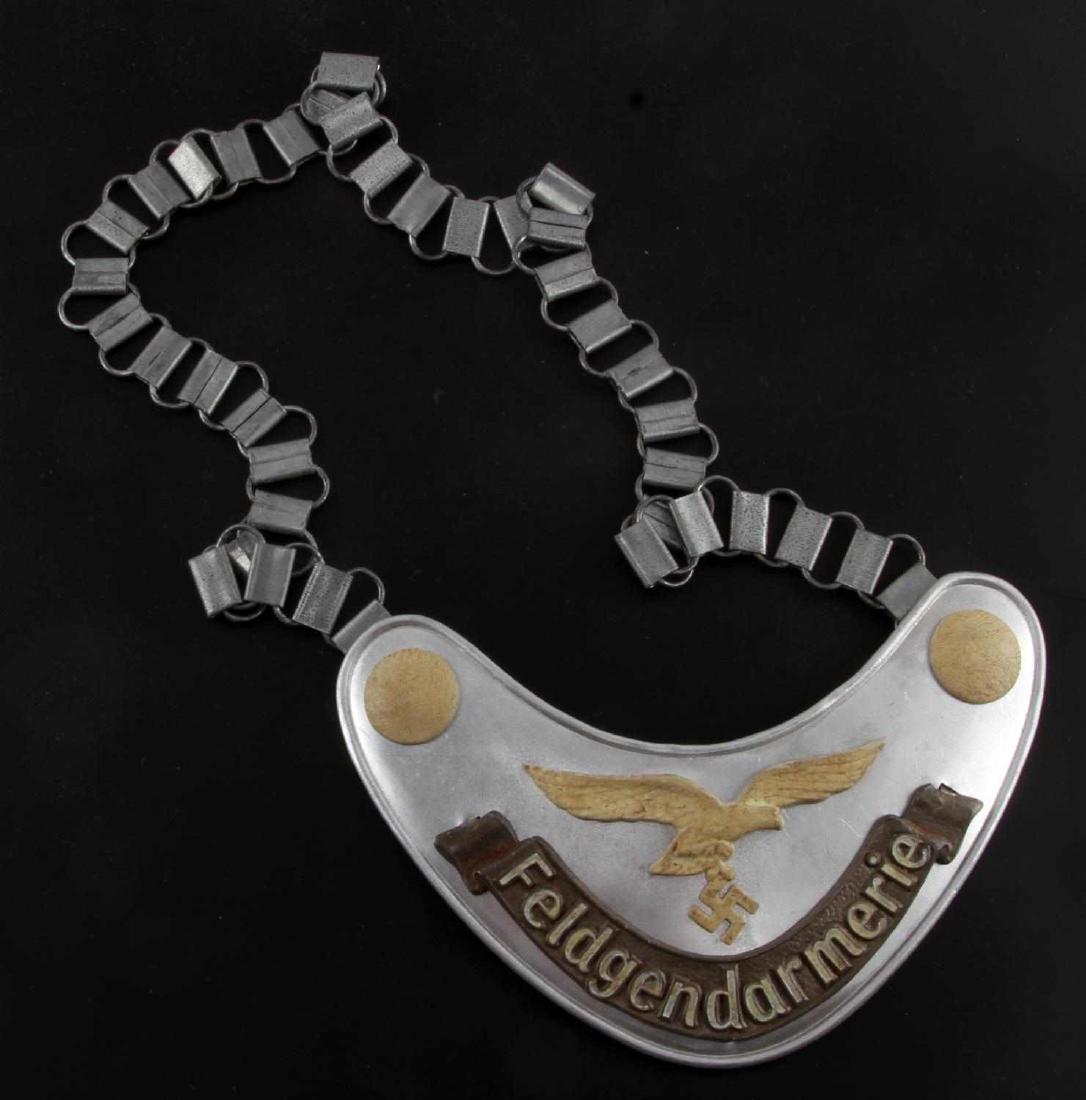 GERMAN WWII LUFTWAFFE FIELDZHANDARM GORGET W CHAIN: German WWII Luftwaffe Fieldzhandarm Gorget with chain. Reverse hook stamped with Luftwaffe eagle and date '1935'. VG condition. Passes "glow-in-the-dark" test. Unauthenticated, sold as is.