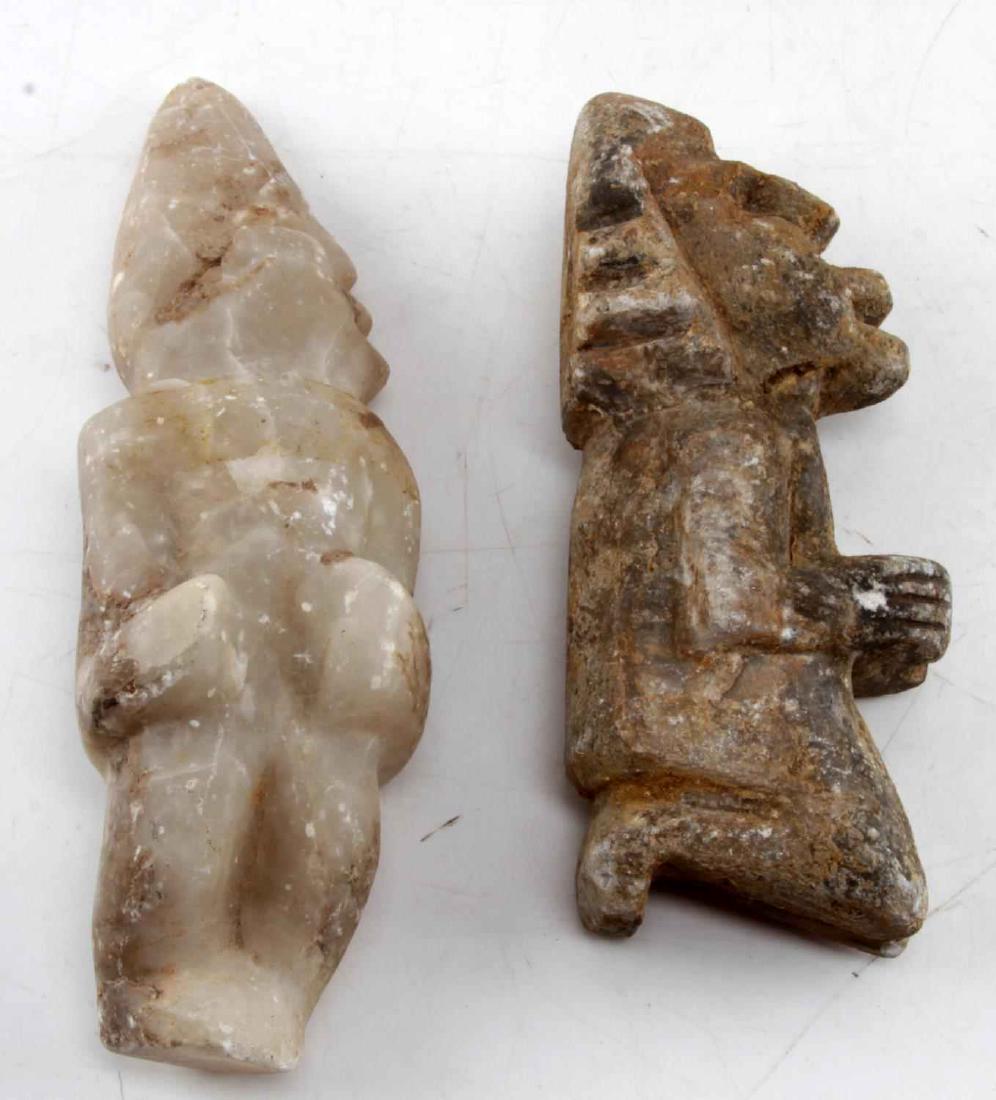 ANCIENT MAYA CARVED STONE FIGURINE LOT OF TWO: Lot contains two carved stone figurines, believed to be of Mayan origins. One depicts a kneeling figure made of igneous rock. Measures 7 3/4 inches in height. The second is a standing figure formed fr