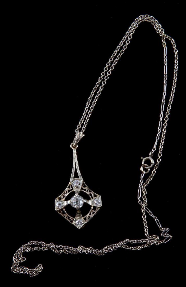 ART DECO 14KT GOLD DIAMOND TCW .4 PENDANT NECKLACE: Total weight 4.5 grams. Art Deco period tear drop pendant in 14kt white gold with one 4mm mine cut diamond surrounded by four 2mm mine cut diamonds (TCW 0.4) on a 18 inch 14kt white gold chain.