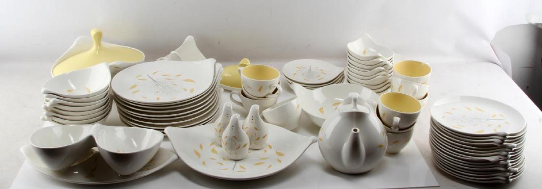 HALLCRAFT EVA ZEISEL SUNGLOW DINNERWARE SET OF 78: 78-piece set of Hallcraft dinnerware by Eva Zeisel, part of the Sunglow line. Includes two serving platters, one serving bowl, gravy boat and ladle, 10 large plates, a tureen, two pepper shakers, one