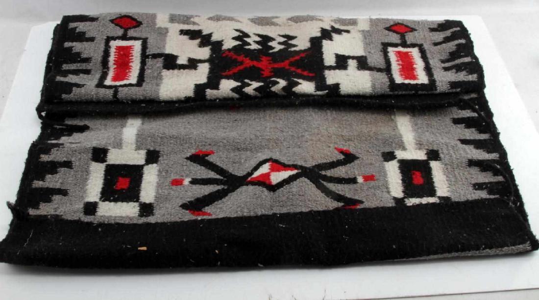 VINTAGE NAVAJO CRYSTAL STORM PATTERN WOOL RUG: In very good condition with minor use wear and staining, measuring 60 by 29 inches. G3
