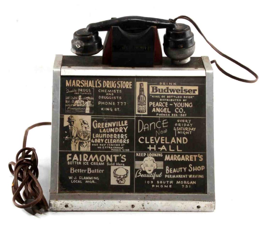 ANTIQUE ADVERTISEMENT RESTAURANT TELEPHONE TOPPER: Topper to an antique telephone likely from a local lunch counter or ice cream parlour. Topper has six businesses advertised with between three and six digit phone numbers. Measures roughly 11 inches b