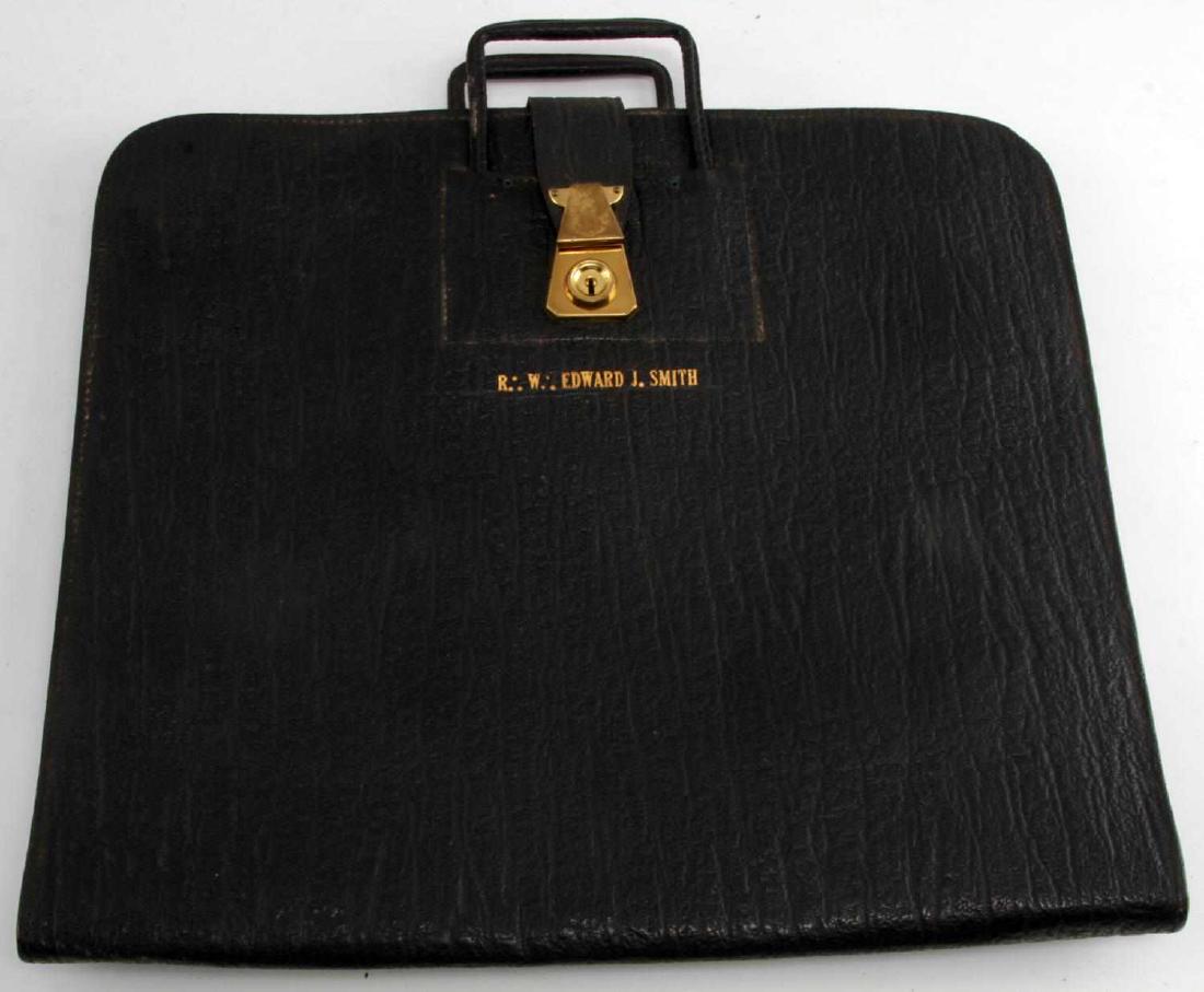 1950'S MASONIC APRON AND LEATHER CASE: 1953 Masonic Apron "Presented to Mr. R.W. Edward J. Smith, Grand Treasurer of the Grand Lodge State of New York" Dated June 4, 1956. Case is also Embossed "R.W. Edward J. Smith" G3