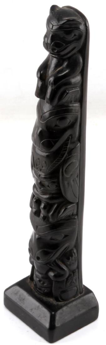 SIGNED TAMARACK INUIT TOTEM SCULPTURE HAND CARVED: This large 11" tall Tamarack Inuit totem was hand carved out of hard stone and polished smooth. On its bottom, it is signed "Tamarack Stonecraft Canada #606." This piece is in very good conditon showi