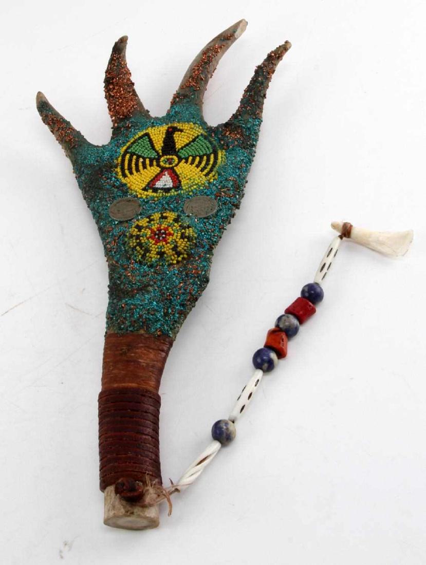 NATIVE AMERICAN ANTLER CEREMONIAL DECORATVE WAND: Native American antler ceremonial wand. Heavy decorated. Displays blue and gold flaking mixed in with eagle designed bead pattern. Bone and colored bead chain. Measures a total length of 15".