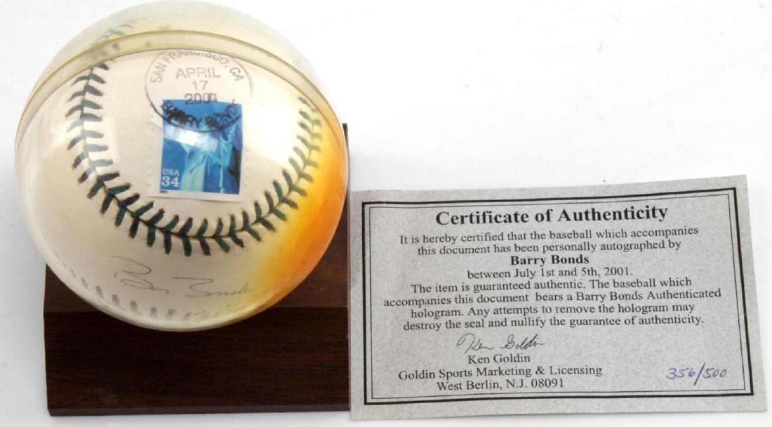 BARRY BONDS SIGNED AUTOGRAPHED BASEBALL W/ COA: On wooden stand, with hologram authentication sticker, authenticity paper by Ken Golden.