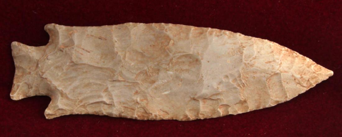 N AMERICAN PALEO LITHIC CLOVIS POINT ARROWHEAD: This medium/large point measures 5 and 7/8" in length and is made of brown and red muddled slate. This piece demonstrates precise parallel flaking and good polish work. It was found in the Midwest Uni