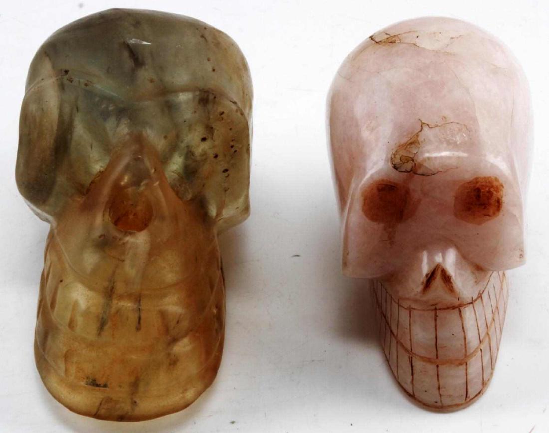 2 ANTIQUE HAND CARVED QUARTZ HUMAN SKULL LOT: One translucent the other pink, each stands about 4 inches and are very good.78