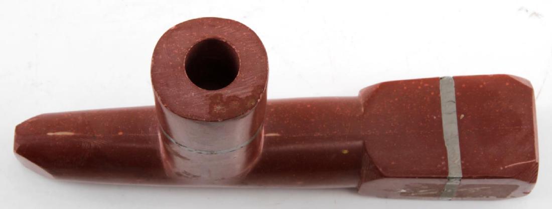 ANTIQUE NATIVE AMERICAN CATLINITE ELBOW PIPE: Early 20th century, with silver wraps, very good damage free condition, measures 7 by 3.5 inches. 77