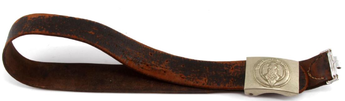 WWII GERMAN THIRD REICH HITLER YOUTH BELT BUCKLE: German WWII Hitler Youth leather belt with belt buckle. Buckle reads "Blut und Ehre" (blood and honor). Leather has wear consistent with age. Measures 32" in length.