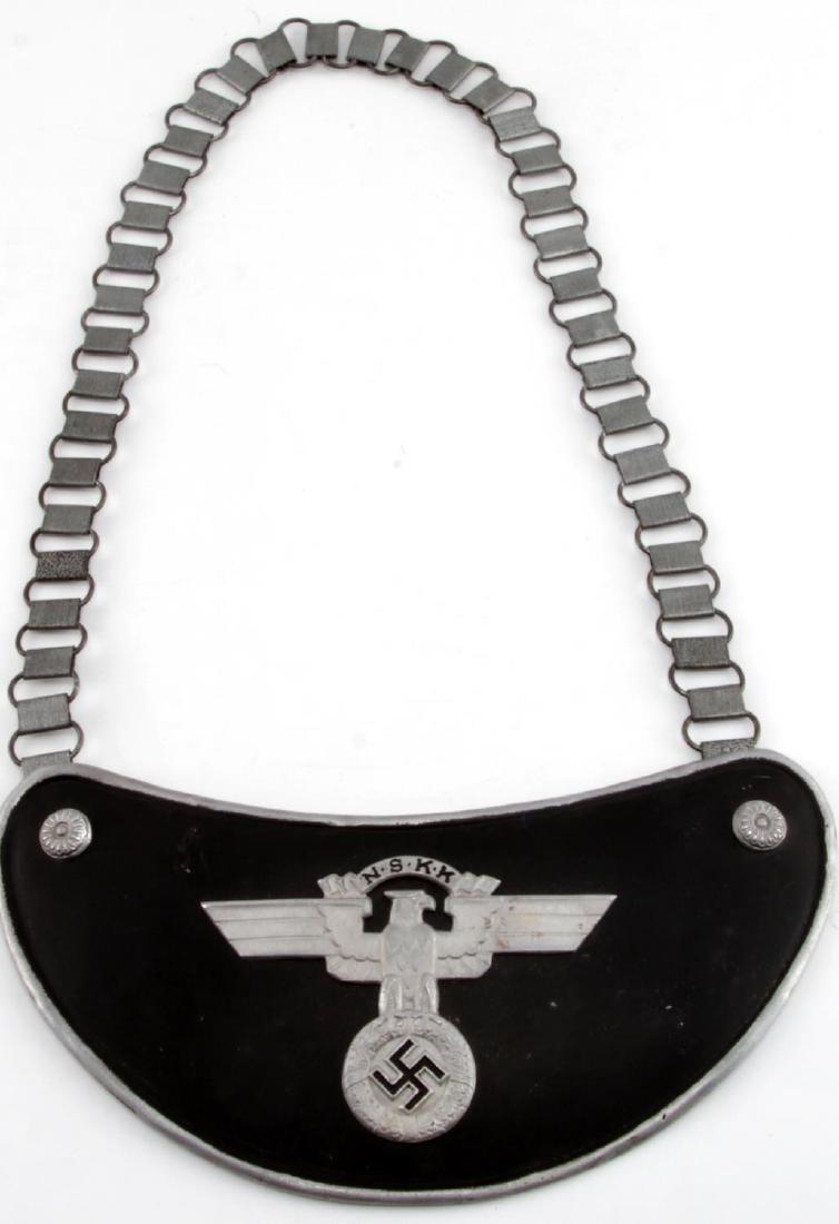 WWII GERMAN THIRD REICH NSKK FLAG BEARER GORGET: Gorget of an NSKK standard bearer. Stamped aluminum construction. Has maker markings. Unauthenticated/Sold 'as is' This lot has a reserve.