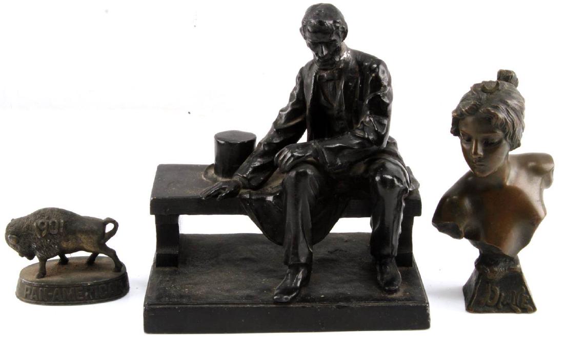 DESK TOP STATUE LOT OF 3 LINCOLN BUFFALO DIANA: Lot of THREE includes metal Abe Lincoln on bench (6 x 6 inch), bronze "Diane" bust of young woman (5 x 3 inch), and bronze 1901 "Pan-American Exposition" Buffalo (2.5 x 2 inch). All in good condition.