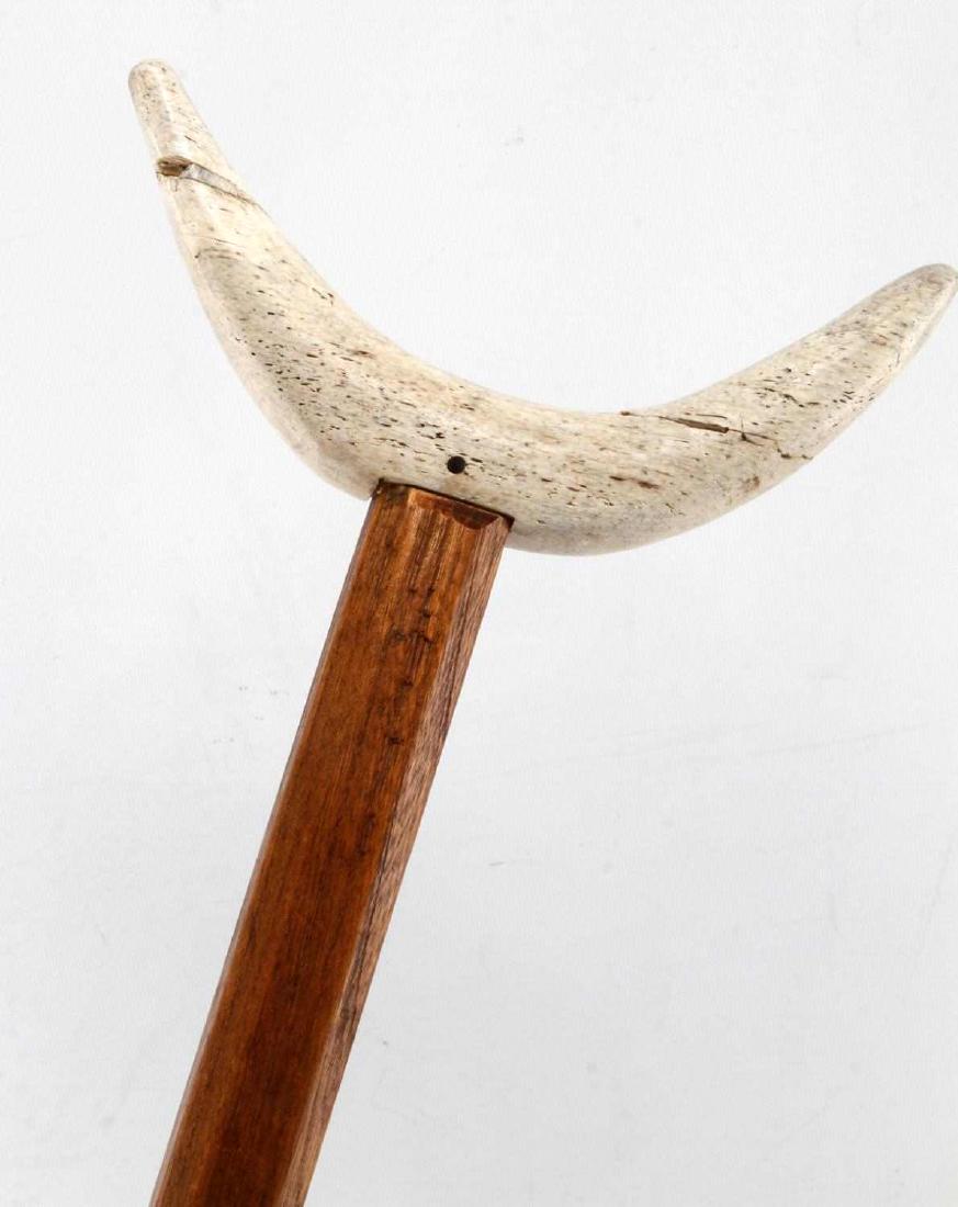 CIVIL WAR BONE CURVED SHOULDER SOLDIER CRUTCH: Measuring 52.5 inches in length with curved shoulder - brace crutch with curved crutch portion made of carved bone. Item is in excellent condition with no signs of wear beyond expected wear & aging.