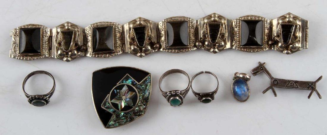 SOUTHWESTERN & NATIVE STERLING SILVER JEWELRY LOT: Total weight 68 grams. Lot includes Alpaca, , abalone shell, onyx and turquoise. Taxco tribal mask bracelet measures 7 inches and has 3 missing earrings from the tribal headdress sections. Rings are s