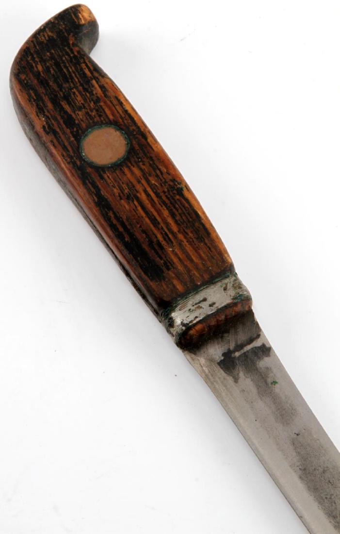 HANDMADE WWI TRENCH FIGHTING KNIFE W DAGGER BLADE: Handmade WWI Trench fighting knife with dagger's blade and hand-made wooden handle. The metallic crossguard is also a metallic locket, with central brass dowel fitting. Measures 10 inches long total ;