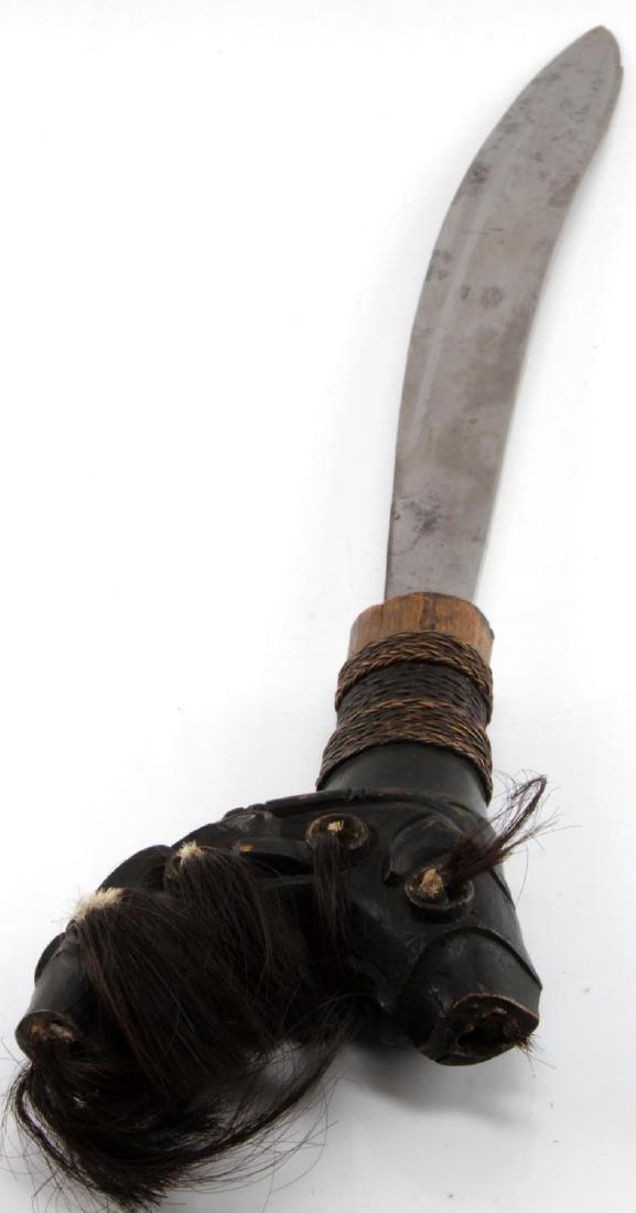 PACIFIC ISLANDERS LARGE MACHETE W WOODEN SCABBARD: Large Antique Pacific Islander's Machete with wooden scabbard, woven-twine fastening straps, large pommel with black horsehair attached. The blade alone measures 16.5 inches long while the length of t