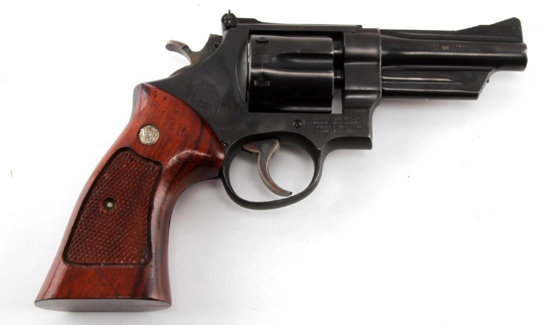 SMITH AND WESSON MODEL 28-2 HIGHWAY PATROLMAN .357: Smith and Wesson model 28-2 double action revolver. Chambers in .357 magnum. Marked on barrel 'HIGHWAY PATROLMAN'. Serial number N100273 (produced between 1969-1982). Bluing is strong and displays onl