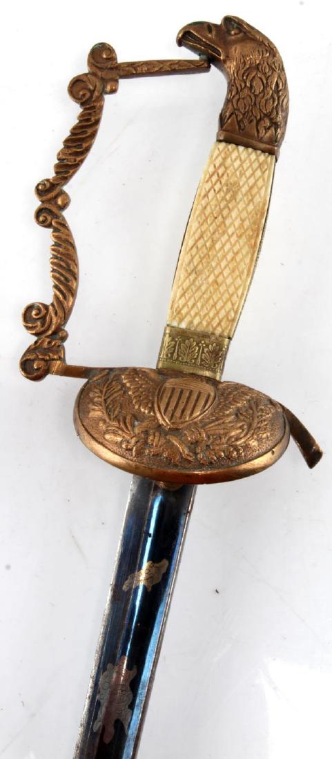 BRASS EAGLE HEAD POMMEL MILITIA SWORD BONE GRIP: U.S. War of 1812 Era Militia Sword. Brass Eagle Head Pommel Bone Grip Blued and Etched Blade light surface corrosion. 35.5" overall length. UEW314