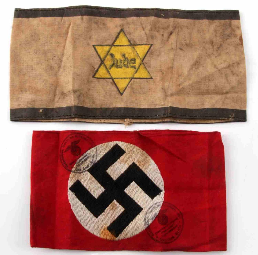 WWII GERMAN THIRD REICH ARMBAND LOT OF TWO: Lot contains two armbands, one a white armband with black bands and a yellow Star of David with 'Jude' in the center. The second is a single-piece construction red with swastika roundel stitched into 
