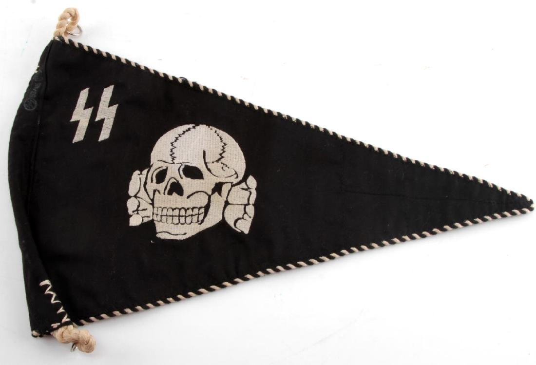 WWII GERMAN THIRD REICH SS TOTENKOPF PENNANT FLAG: SS triangular pennant with SS runes and Totenkopf. Measures approximately 14 inches long, and has a reinforcement panel at the tip to prevent fraying. Double sided. Alternating black and white piping.