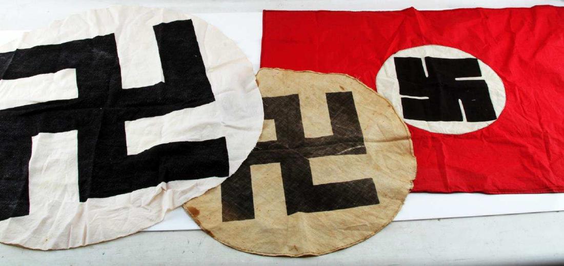 WWII GERMAN THIRD REICH NSDAP FLAG LOT OF 3: This lot includes 1 20" circle swastika meant to be stitched into a 2-3 pc flag, 1 30" circle swastika, and 1 30" X 22.5" unique fat swastika design banner. These items are deemed authentic and theref