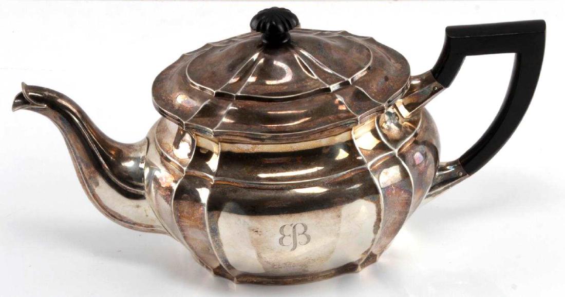 EVA BRAUN PERSONAL STERLING SILVER TEA POT WWII: Eva Braun personal sterling silver teapot from the German WWII era. "Butterfly" monogram seen on left face of pot. Hallmarks as well as 925 stamp seen next to base of handle. Maker on base 'MENNER STU
