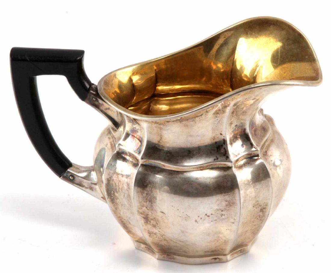 EVA BRAUN PERSONAL STERLING SILVER GRAVY DISH WWII: Eva Braun personal sterling silver gravy pot. Marked with hallmarks and a 925 silver stamp next to base of handle. Body displays infamous "Butterfly" monogram. Base shows maker mark 'MENNER STUTTGART'