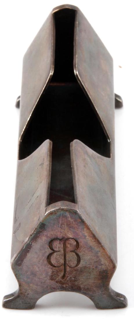 GERMAN WWII EVA BRAUN PERSONAL VANITY WEAR ITEM: German WWII Eva Braun personal vanity wear item. "Butterfly" monogram visible on both ends. Maker mark 'WELLNER 3' can be found on base. Measures 4 1/4" x 1 3/8" x 1 3/4". Light tarnishing, VG conditi