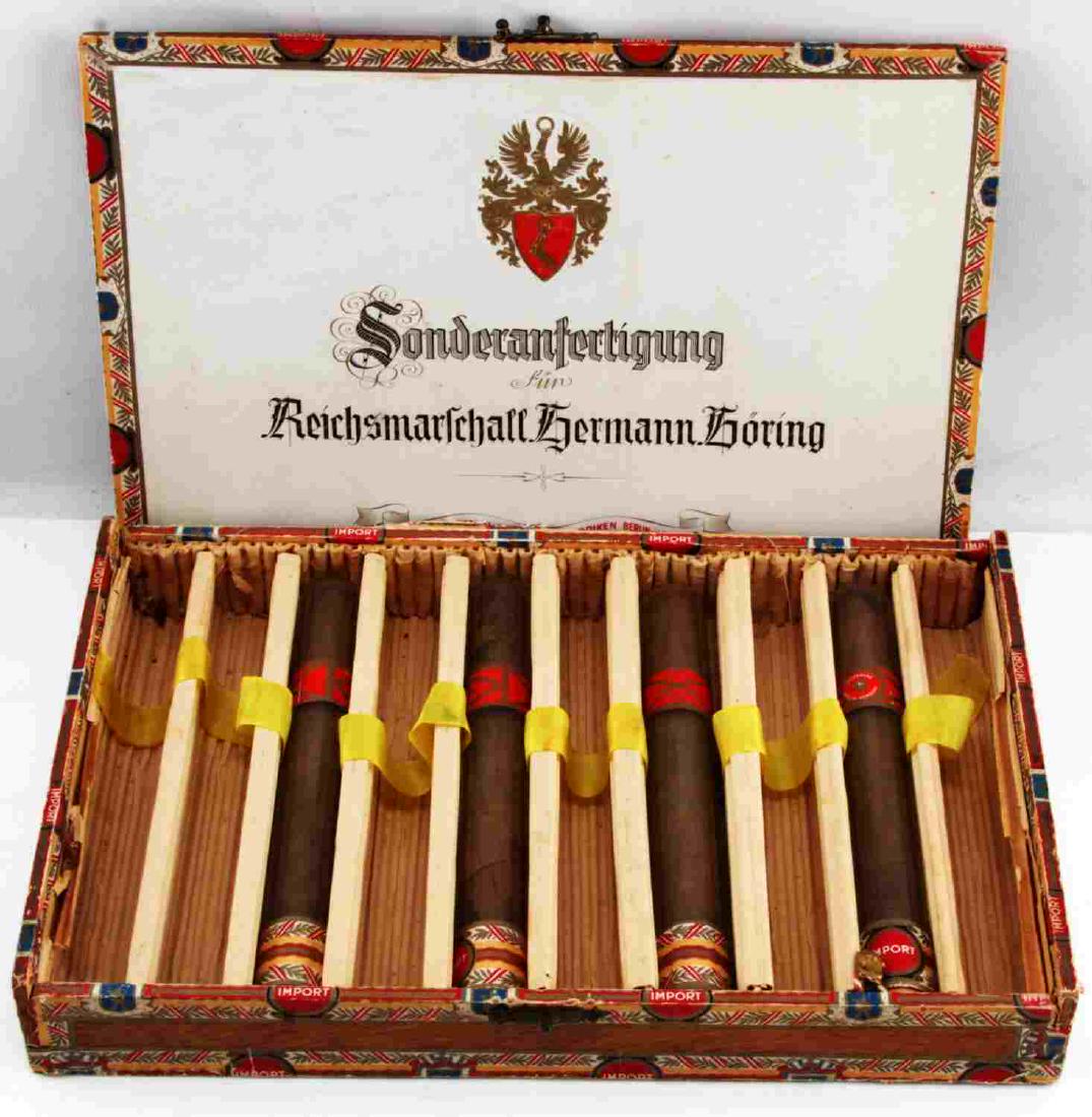 THIRD REICH HERMANN GORING 4 CIGARS AND BOX: Box of 4 Gildemann Cigars Custom made for Hermann Goring "Sonderanfertigung Fur Reichsmarschall Hermann Goring" Box lid detached and 4/10 cigars present. MA48 This lot has a reserve.