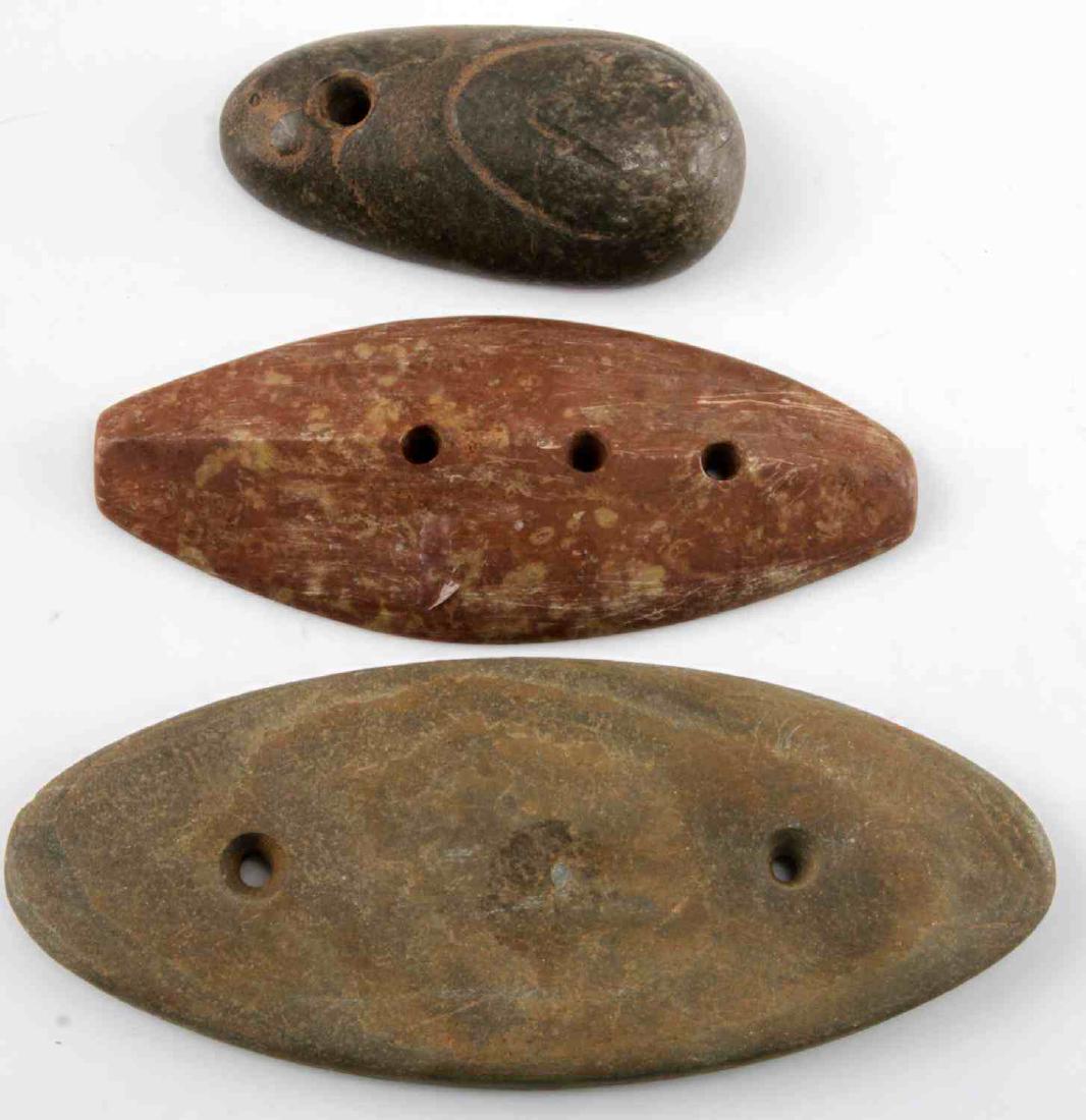 WOODLAND PERIOD HARD STONE GORGET & PENDANT LOT: Lot includes: two hole gorget (5.5 inch), three hole smooth red stone gorget with lighter inclusions (4.5 inch), and a carved stone pendant with indentation to one side (3 inches). All in very good co