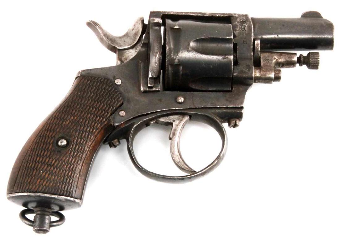 BELGIAN R.I.C DA 6 SHOT REVOLVER .320 COLT ANTIQUE: Proof marks all over, number 8 is marked three times (cylinder, ejector arm, half moon piece). Barrel measures 1.75 inches with fair bore. Brown patina with areas of oxidation. Wood grips and ring to 