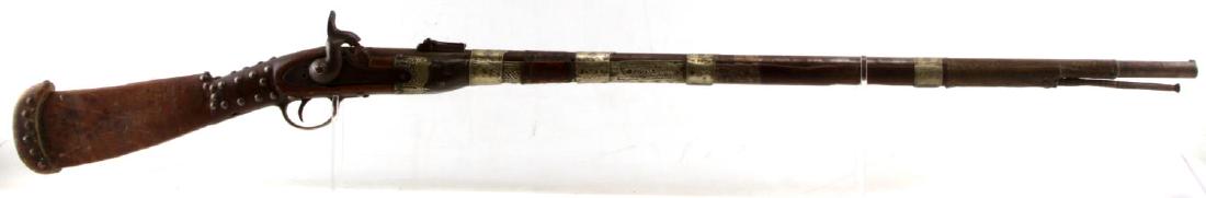 ANTIQUE BEDOUIN ARAB VICTORIAN SIDE PLATE MUSKET: Antique musket with Brown Bess barrel, side plate with Victorian crown marks, percussion cap lock, and ladder sight. The furniture and stock appear consistent with 19th century Arab designs. The barre