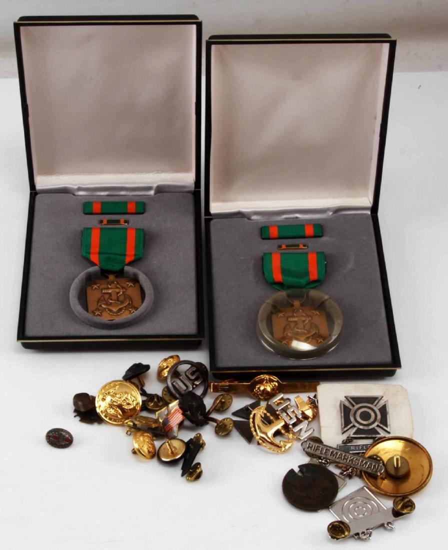 COLLECTION OF MISC MILITARY PINS BUTTONS & CLASPS: Lot consists of miscellaneous hat pins, tie clasps, dress coat buttons and military pins. Two navy achievement ribbons in the presentation cases.