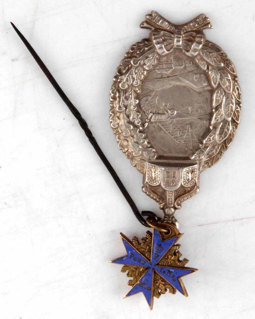 WWI IMPERIAL GERMAN PILOT BADGE & BLUE MAX MEDAL: This lot includes 1 Imperial German WWI Pilot's badge and 1 small Pour le Merite "Blue Max" enameled order medal. Both are attached to a WWI knurled stickpin for civilian wear. Very good condition. Pa