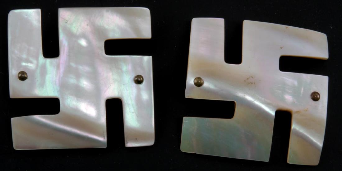 2 GERMAN WWII MOTHER OF PEARL GOOD LUCK BUCKLES: "Good Luck" swastika belt buckles. Brass and nacre construction. Measure 1 3/4" x 1 3/4". Light scratching to their faces, VG condition. MA135.