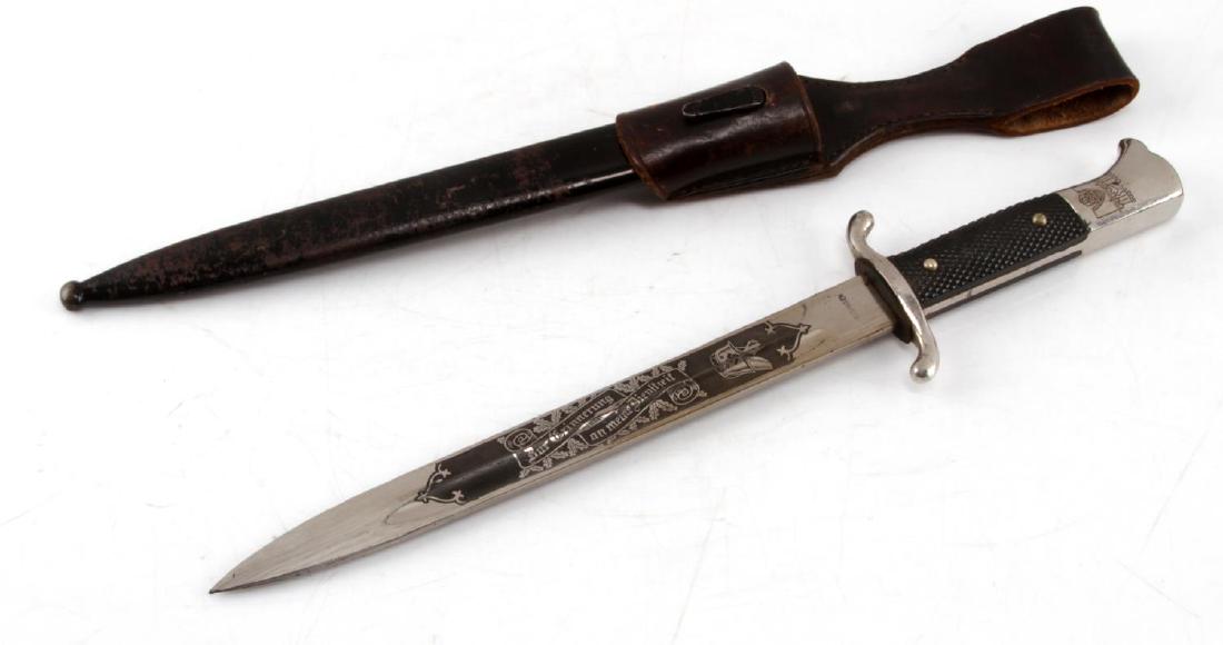 WWII VOLKSWAGON FACTORY FIREMANS DRESS BAYONET: Double edged fireman's double etched dress bayonet. Blade marked Solingen. Pommel has the WWII Volkswagen logo etched on birds head. Front panel shows floral pattern with "In Remembrance of My Service