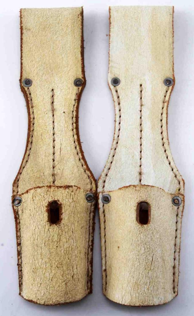 WWII THIRD REICH SS PARADE BAYONET BELT FROG LOT: Two Waffen SS parade dress bayonet frogs. White painted leather with machine sewn construction. Each frog measures 9 inches in length and 2 5/16 inches in width. Backs are stamped with "Lederfabrik Ho