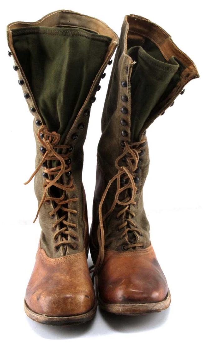 WWII THIRD REICH AFRIKA KORP TROPICAL COMBAT BOOTS: WWII German Army/Luftwaffe Afrika Korps tropical combat boots. Boots measure 11 1/2 inches long by 4 1/8 wide. Both soles are marked "42". Soles are hob nailed. Leather and OD green canvas with machin