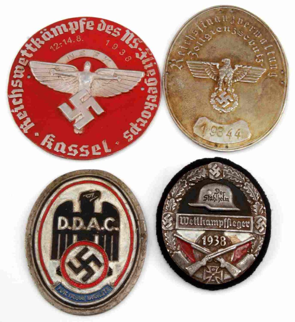 WWII GERMAN THIRD REICH PLAQUE LOT OF FOUR: Lot contains four metal plaques from the Third Reich. Includes NSFK pilot competition, 'Stahlhelm' shooting competition, a DDAC badge, and a Third Reich Customs Agent plaque. All are around 3 inches i
