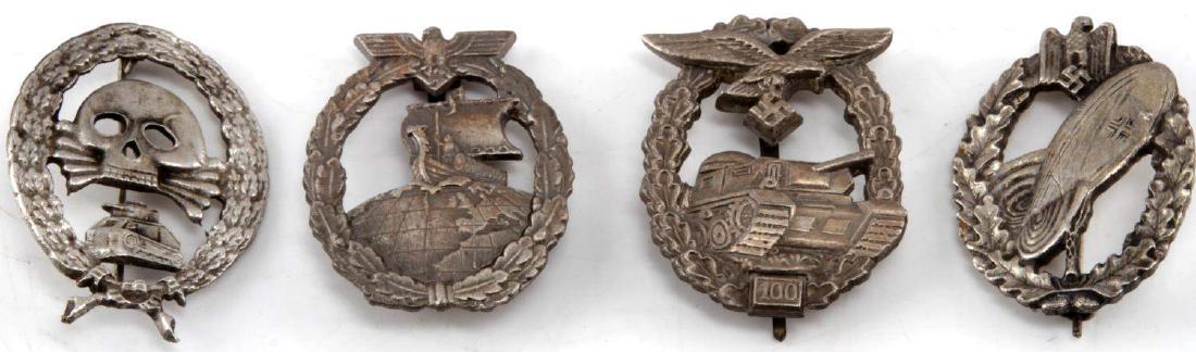 WWII GERMAN THIRD REICH ASSORTED BADGE LOT OF 4: Lot includes a variety of WWII German badges including: 1 Luftwaffe panzer assault badge with 100 actions, 1 Kriegsmarine Auxiliary Cruiser badge, 1 Army Balloon pilot badge, and 1 Spanish Civil war t