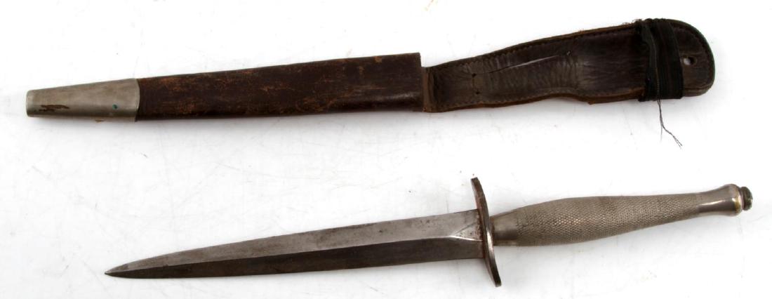 WWII IRBAIRN SYKES FIGHTING COMMANDO KNIFE: This is a 1st pattern Fairbairn Sykes WWII British commando fighting knife. It has a 6 and 5/8" blade and measures 11.5" in total. No maker marks are present on the riposte. Leather sheath and knife a