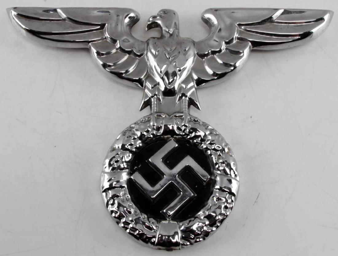 WWII GERMAN THIRD REICH CHROME REICHSADLER: Chrome-colored Reichsadler likely removed from a building. Has a mounting point on the bottom. Non-magnetic construction. Has a wingspan of 15 1/2 inches and is 11 inches tall. In good condition.