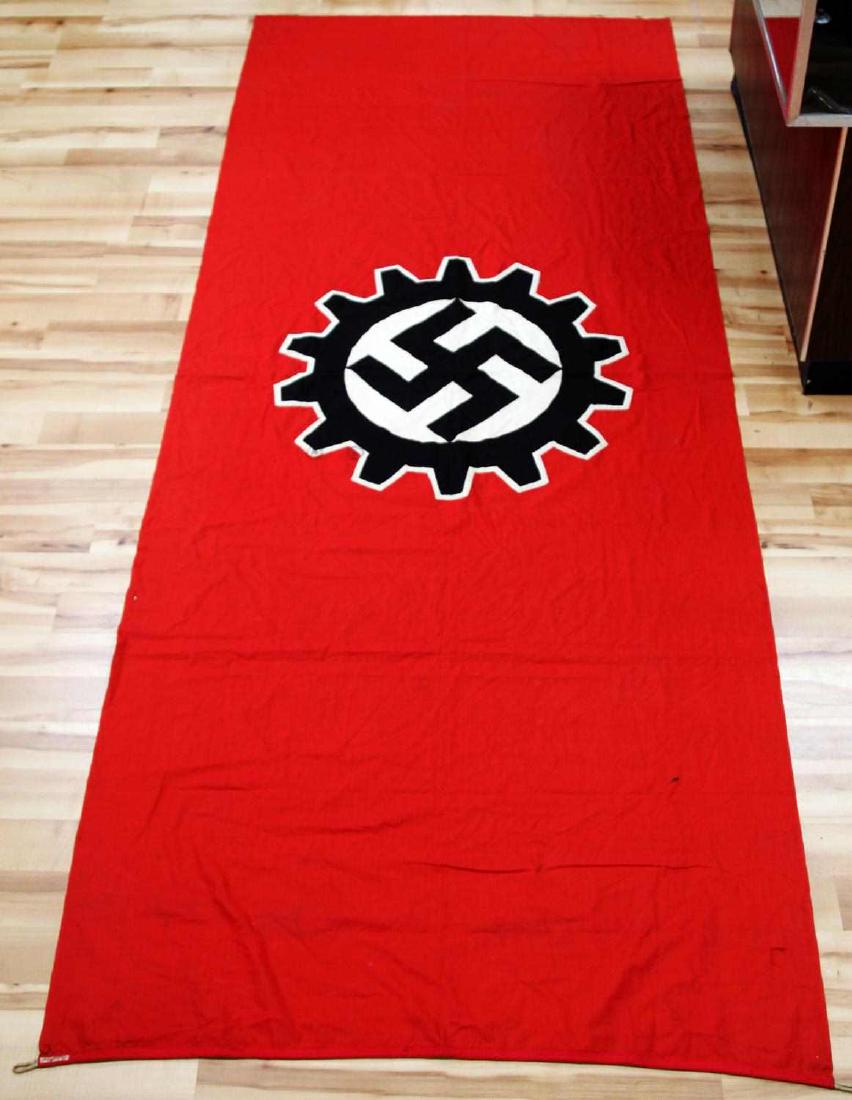 WWII GERMAN THIRD REICH DAF LABOR PARTY FLAG: Large flag measuring 120 by 46 inches, makers tag by hoist, multi piece well crafted flag. Hemp hoist rope, very good original condition. F69