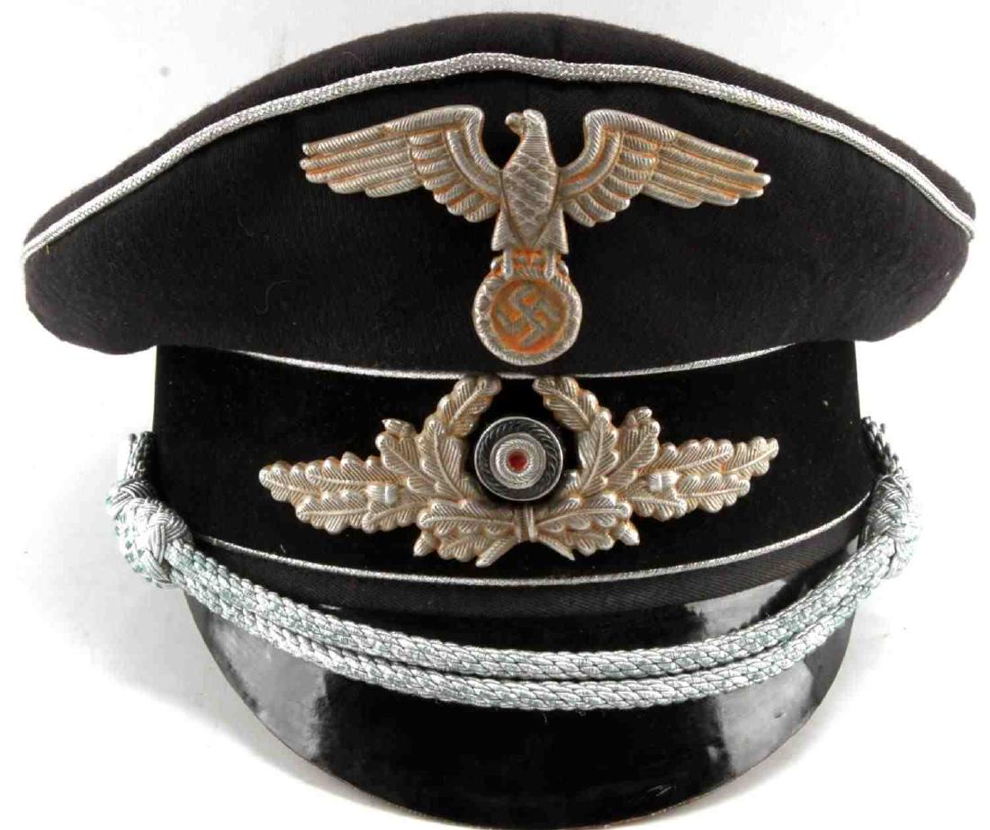 WWII GERMAN THIRD REICH DIPLOMAT PEAK HAT VISOR: Metal insignia, moth free and detraction free, sweat band is machine sewn so probably an old replacement and chin strap has probably been replaced, does not fluoresce and a larger size U.S. 7 1/8