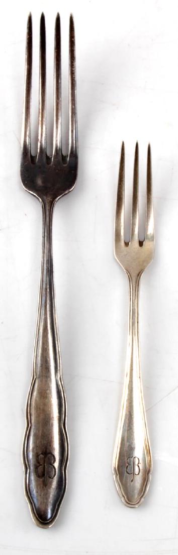 WWII EVA BRAUN THIRD REICH HALLMARK 800 SILVERWARE: WWII era Eva Braun Third Reich silverware set. Two forks. Larger measures 8 inches and smaller measures 5.5 inches. Marked with the Eva Braun butterfly. Hallmark 800 silver. SV2.