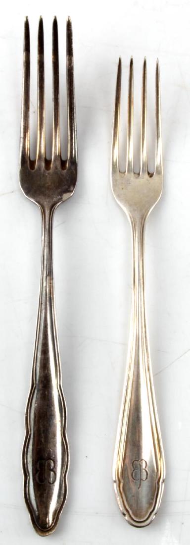 WWII EVA BRAUN THIRD REICH HALLMARK 800 FLATWARE: WWII era Eva Braun Third Reich silverware set. Two forks. Larger measures 8 inches and smaller measures 7.25 inches. Marked with the Eva Braun butterfly. Hallmark 800 silver. SV2.