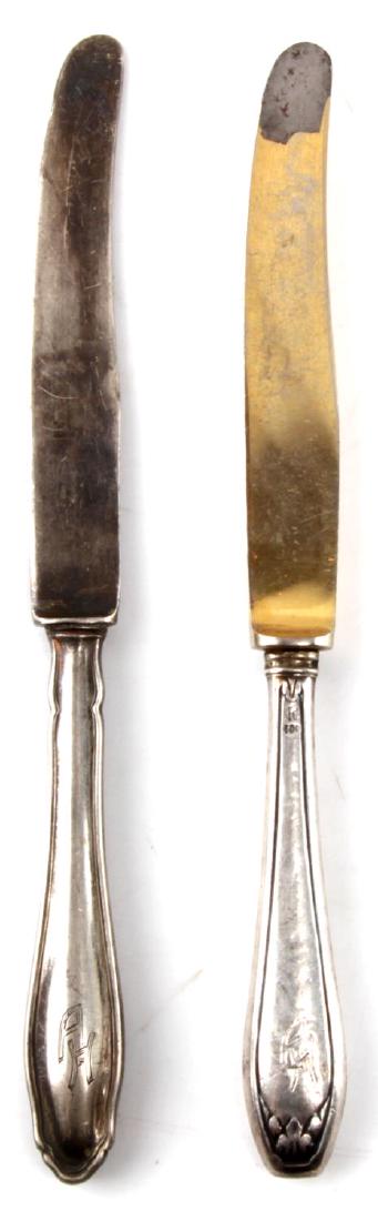 WWII HITLER THIRD REICH HALLMARK 800 SILVERWARE: WWII era Adolf Hitler Third Reich silverware set. Two knifes measuring 6.5 inches each. Marked with AH insignia. 800 silver. German hallmark. EZN maker's mark. SV2.