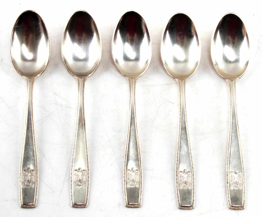 ADOLF HITLER MONOGRAMMED 800 SILVERWARE LOT OF 5: This lot includes 5 "AH" Adolf Hitler monogrammed spoons from Hitler's personal formal silver collection. They are hallmarked 800 silver and test positive for silver content. The spoons measure 5.5" i