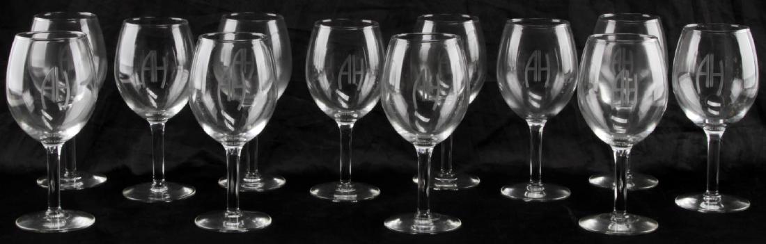 A DOZEN STEMMED WINE GLASSES WITH HITLER INITIALS: Glasses measure 7 inches tall, AH etched into glass. Very good condition. CSG26